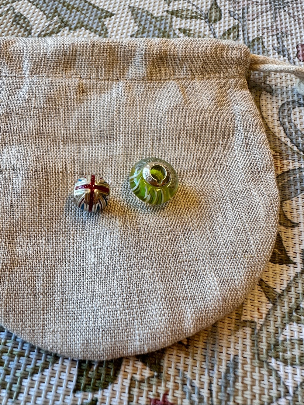 Two Chamilia charms